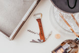 Wine multi tool laser engraved with I love you always on a white tabletop with wine glasses by Legacy and Light
