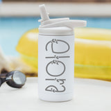 White color 12-ounce stainless steel, flip-top straw tumbler. The tumbler is laser engraved and personalized with the name of the child, the font has little hearts along the name. The tumbler is sitting on a white table with a yellow pool floaty in the background.