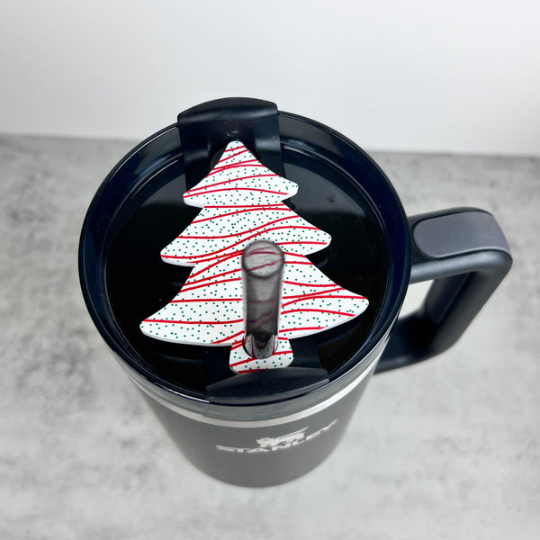 Christmas tree topper for Stanley 20, 30, and 40 ounce with Christmas Snack cake pattern.  The topper is sitting on a black stanley tumbler 