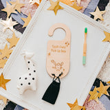 Tooth fairy pick-up box with a toothbrush and toy on a star-patterned background
