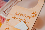 Wooden box labeled 'Tooth Fairy Pick Up Box' with stars engraved on it.