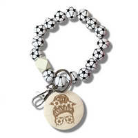 Soccer ball bracelet with a wooden picture of a Mom from the eyes up that have glasses on that look like soccer balls and her bun tied up with a soccer ball ribbon.