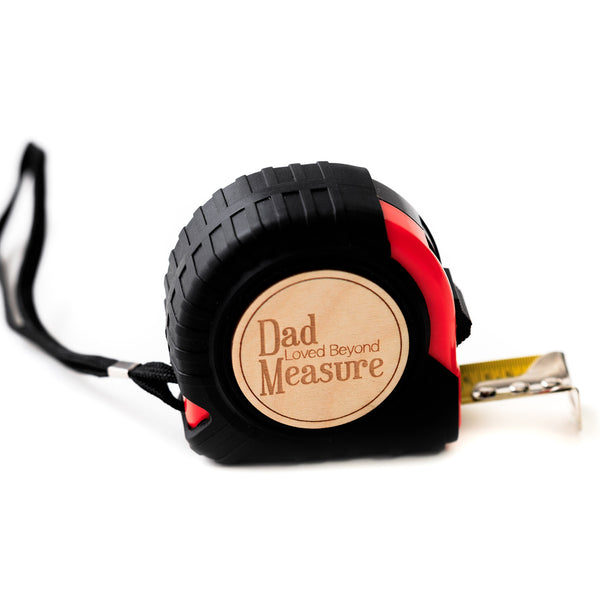 Orange and Black tape measure with wooden disc with 'Dad Loved Beyond Measure' Laser Engraved by Legacy and Light 