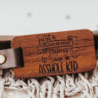 Just a regular mom trying not to raise and asshole kid keychain by legacy and Light