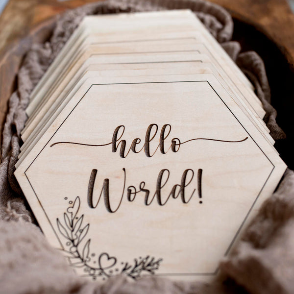 Set of Wooden Hexagon Milestone cards for newborn photography in wooden bowl with muslin blanket