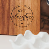 Close up Wooden cutting board with New Home New Adventure New Memories Laser Engraved by Legacy and Light 