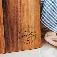 Zoomed in image of Wooden cutting board with New Home New Adventure New Memories Laser Engraved by Legacy and Light 