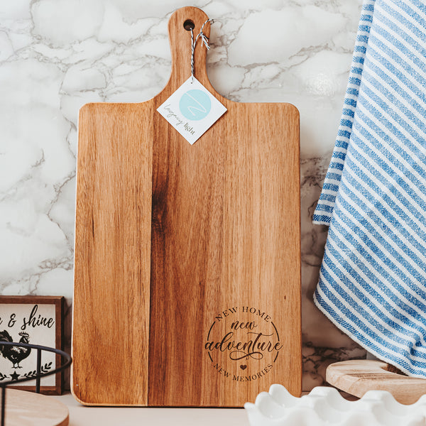 Wooden cutting board with New Home New Adventure New Memories Laser Engraved by Legacy and Light 