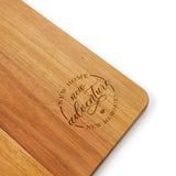 Close up of Wooden cutting board with New Home New Adventure New Memories Laser Engraved by Legacy and Light 
